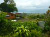 The home and cabina have a beautiful garden setting on an acre with volcano and lake views.